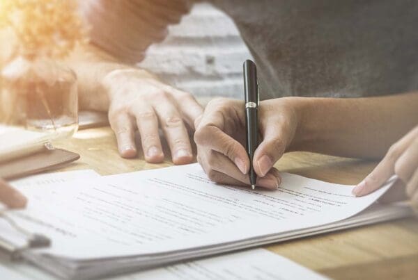 Probate Bond - Close-up of a Woman Giving Her Signature for a Business and Financial Contract In the Office of an Insurance Agent